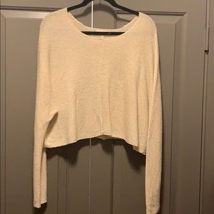 Partly cropped cream colored sweater